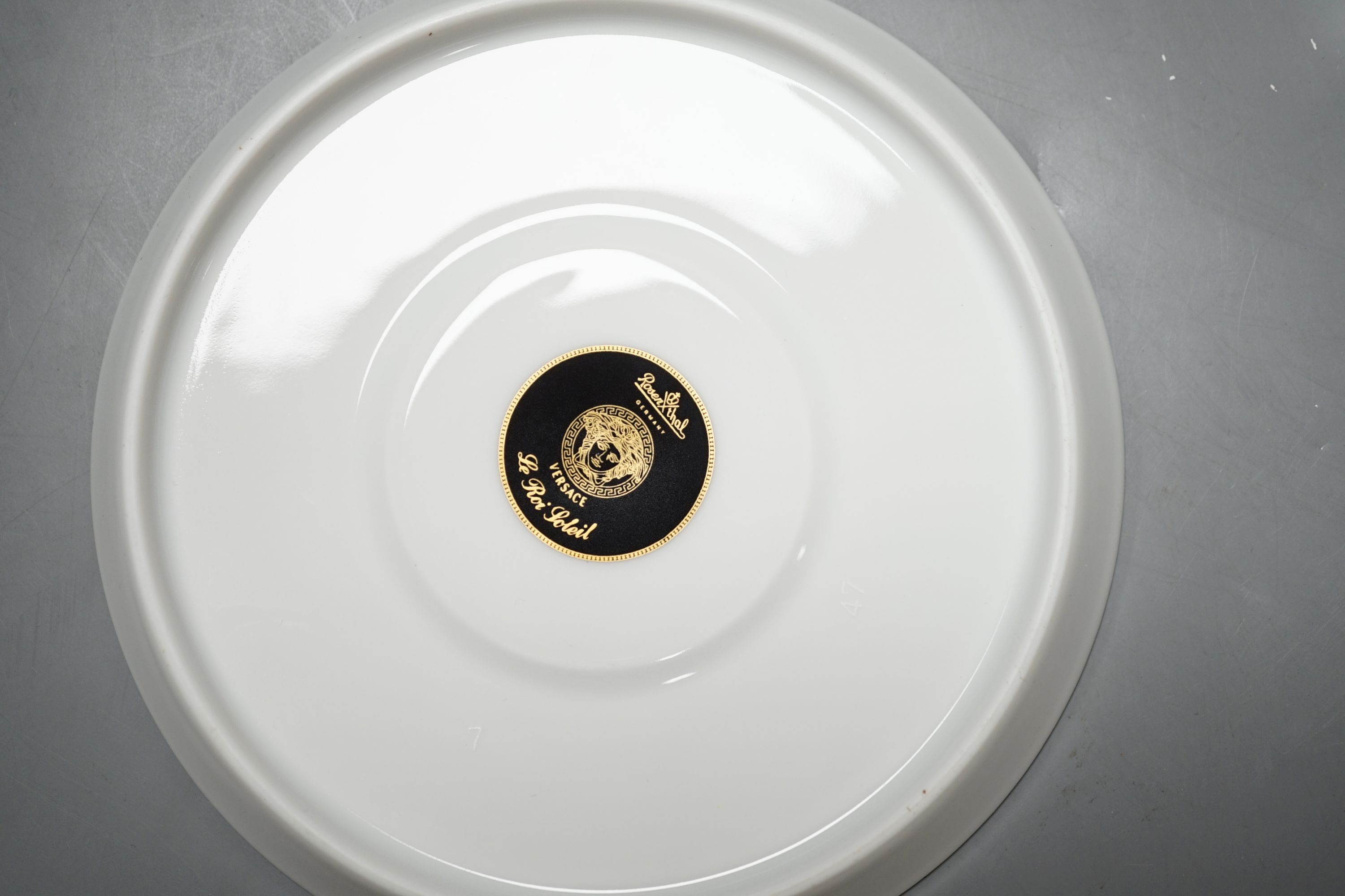 A set of eight Versace 'Le Roi Soleil' pattern cups and saucers